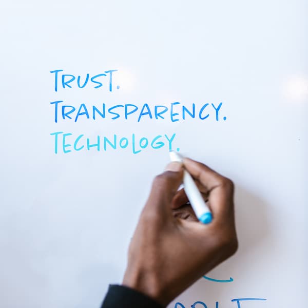 A whiteboard with 'Trust Transparency Technology' written on it
